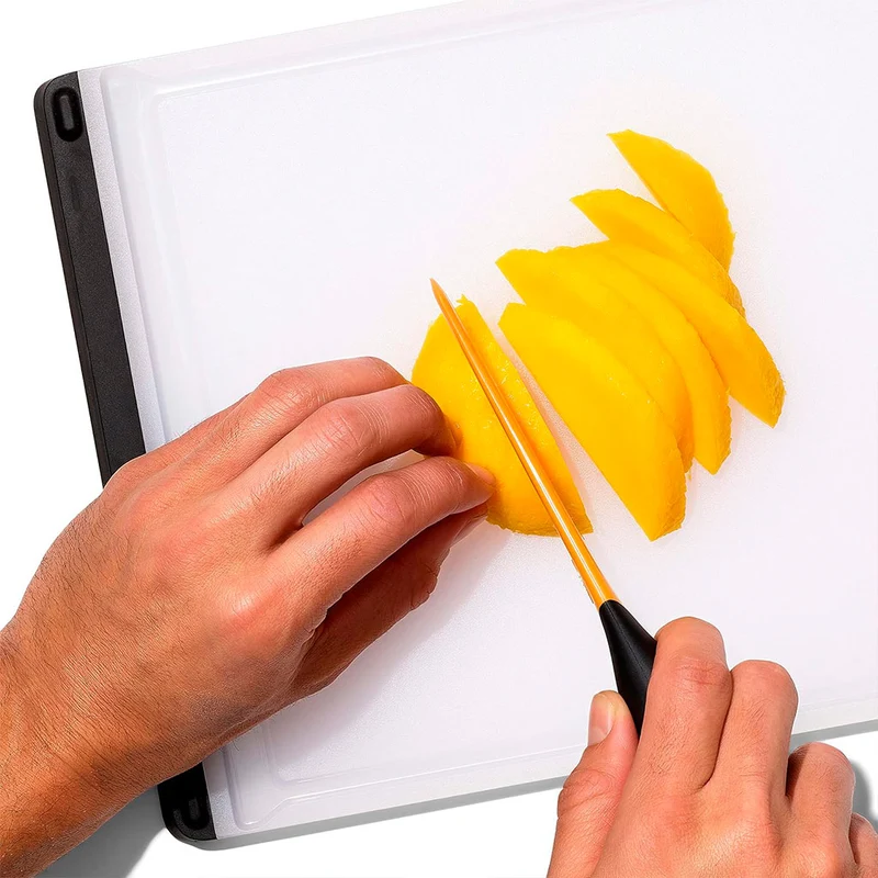 Cortador y cuchara para mango OXO